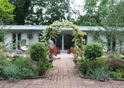 GARDEN CABIN PROJECT cabin archway entrance pathway